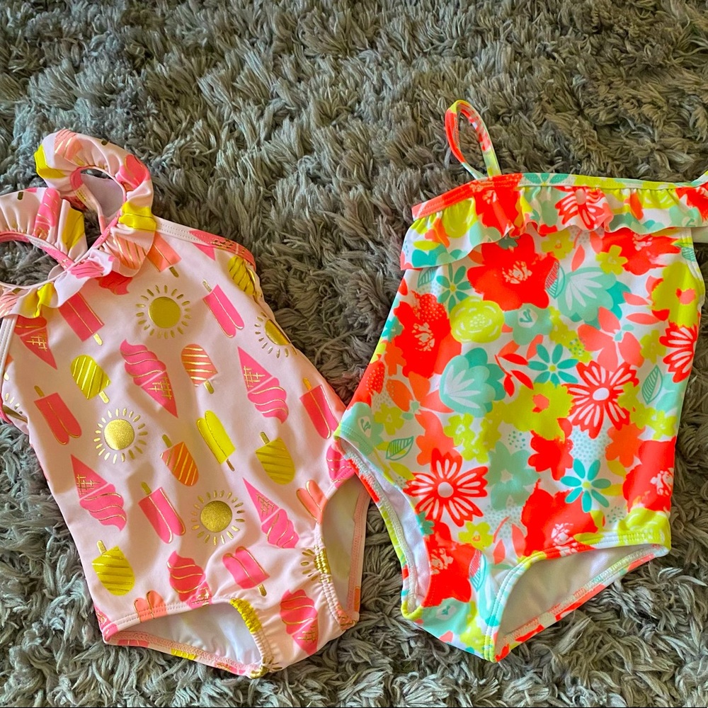 Two baby girl swimsuits